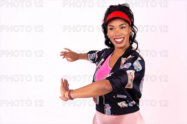 Black ethnic woman with cap dancing on a white background