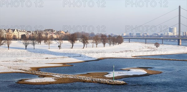 View of the Oberkassel Rhine bank in the snow from the Rheinknie Bridge