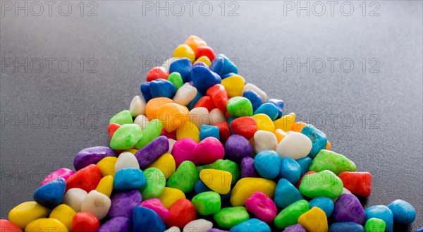 Pile of little colorful pebbles as stone background