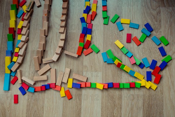 Colorful Domino Blocks in a line on a white background