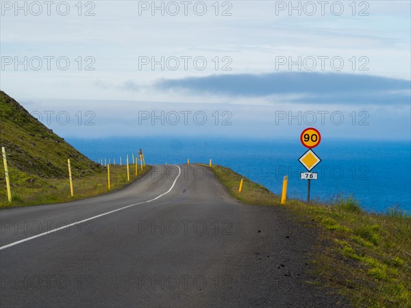 Road with traffic sign in Northern Iceland