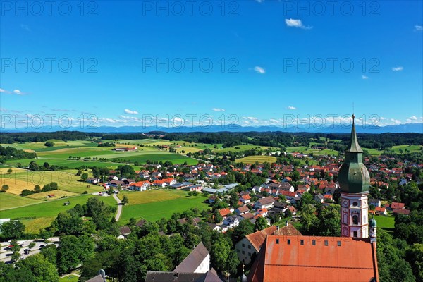 Aerial view of Andechs Monastery with the Alps in the background. Andechs