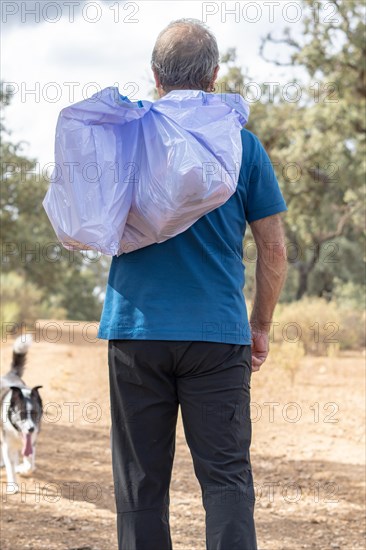 Man on his back with his dog