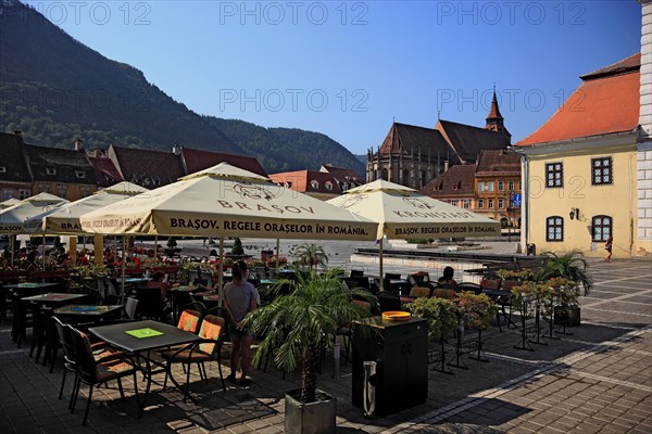 Street cafe in the old town on Piata Sfatului Square of Brasov