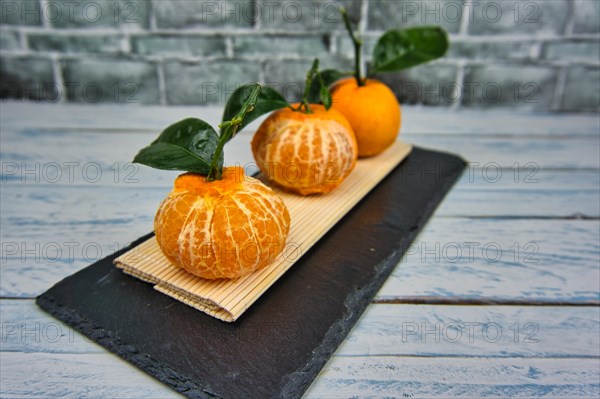 Fresh tangerines sweet clementines with drops of water