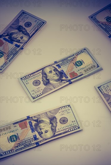 American 100 dollar banknote bundles placed on white background