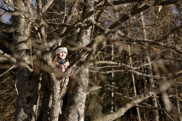 Girl climbing in a tree