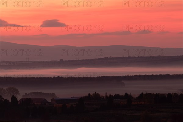 Foggy sunrise over fields in Bohemian Moravia