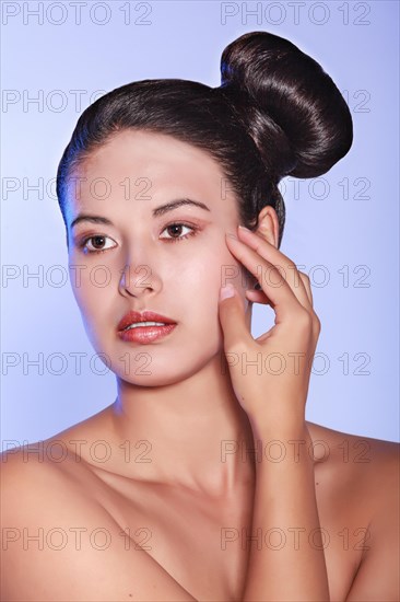 Beauty portrait of a young woman with a special hair style