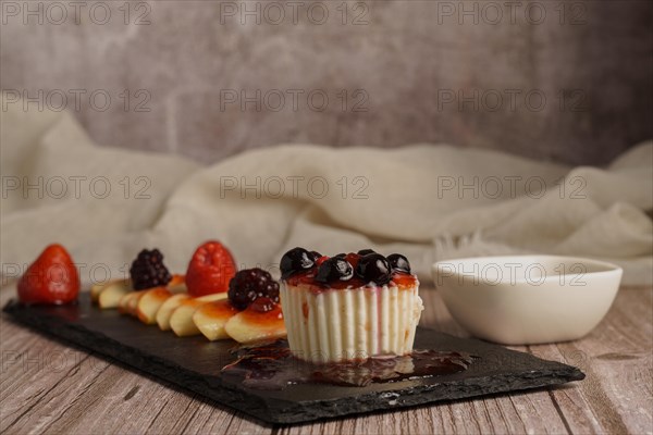 Fresh red apples with drops of water on a slice of wood