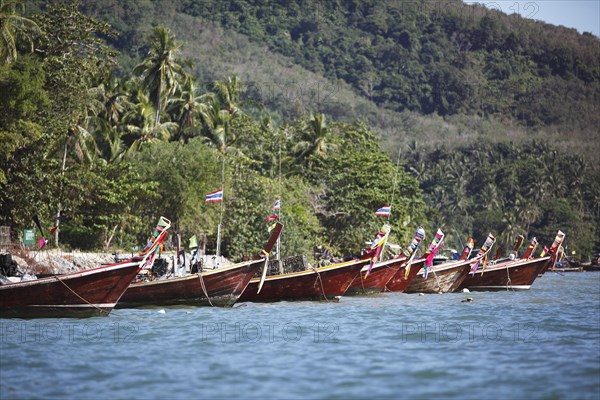 Longtail boats on the island shore
