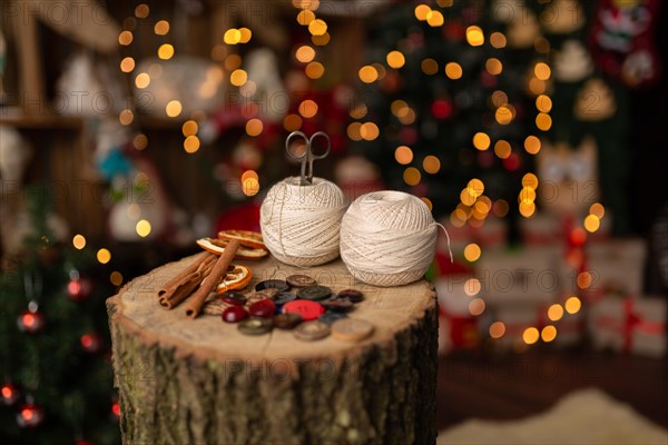 A Christmas scene with beautiful bokeh in the background and sewing tools. In studio