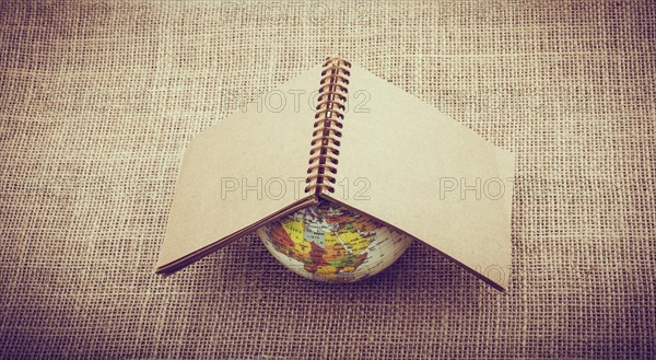 Globe is placed on canvas background