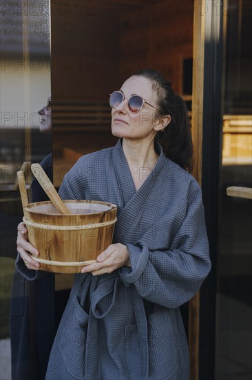 Woman taking a sauna