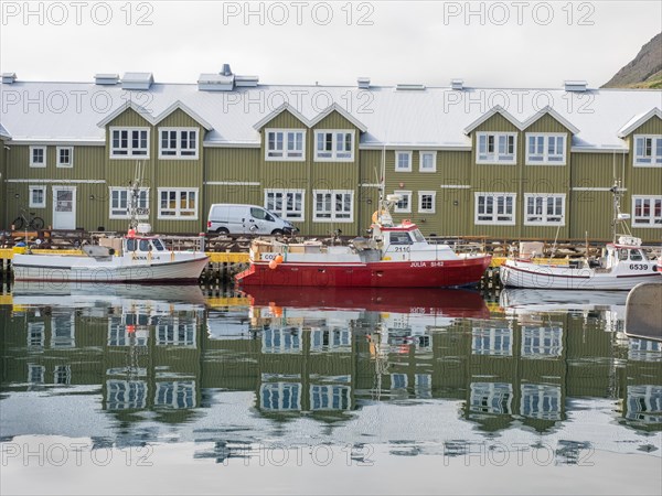 Wooden houses and fishing boats in the harbour