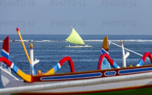 Brightly painted fishing outriggers on the beach at Sanur