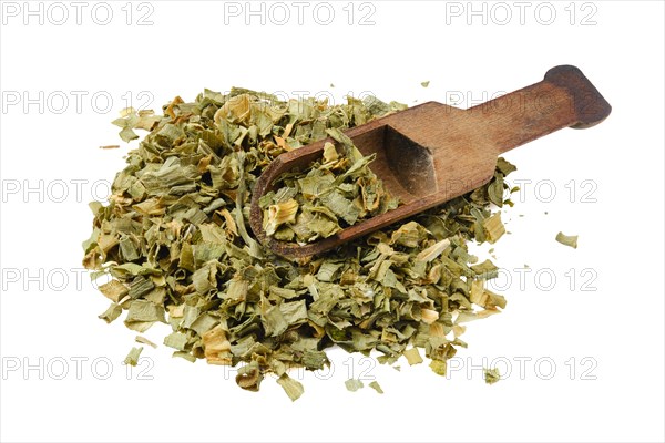 Dried scallions and wooden spoon isolated on white background