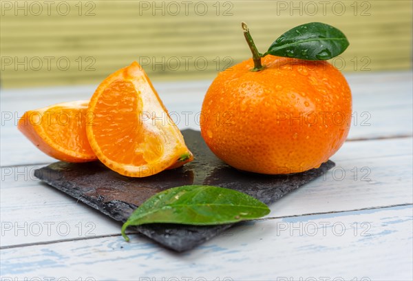 Fresh tangerines sweet clementines with drops of water