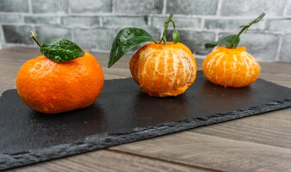 Fresh tangerines sweet clementines with drops of water