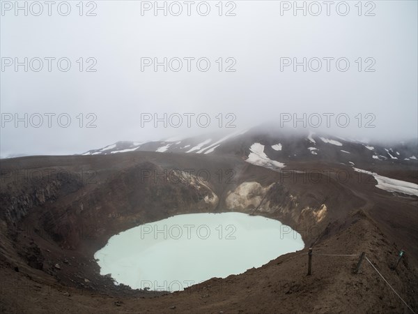 Volcanic crater with blue lake