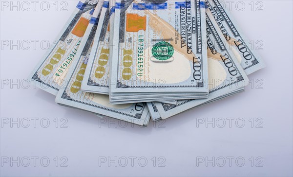 American 100 dollar banknote bundles placed on white background