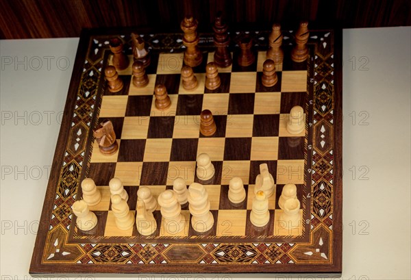 Chess board with chess wooden pieces