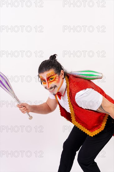 Portrait of a smiling juggler performing juggling isolated on white background