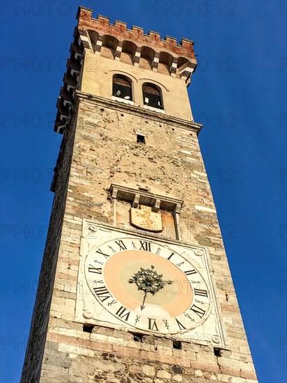 Campanile clock tower Torre Civica Torre Maestra from the Middle Ages in historic centre of Lonato del Garda