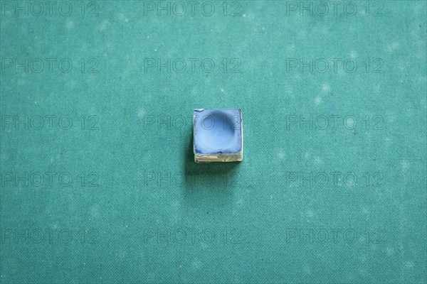 A snooker chalk on a pool table