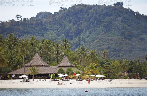 Sandy beach beach and straw huts at Sivalai Resort