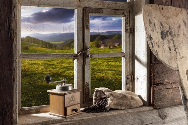 Farmhouse parlour with coffee grinder and coffee beans on the windowsill