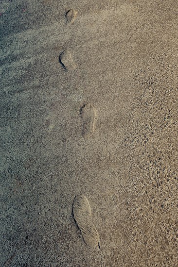 Footstep pattern seen on a concrete background