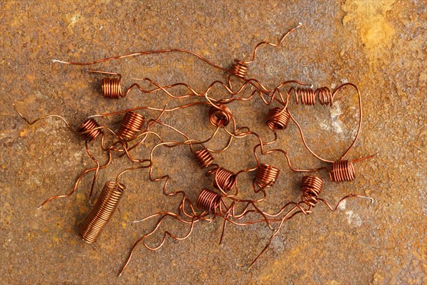 Red metal copper wire scrap materials recycling of waste from manual wire tearing. Closeup of copper waste in the form of copper wires