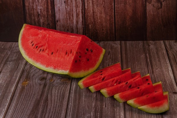 Close-up of fresh watermelon slices on a wooden table