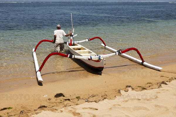 Fishing outriggers on the beach of Sanur