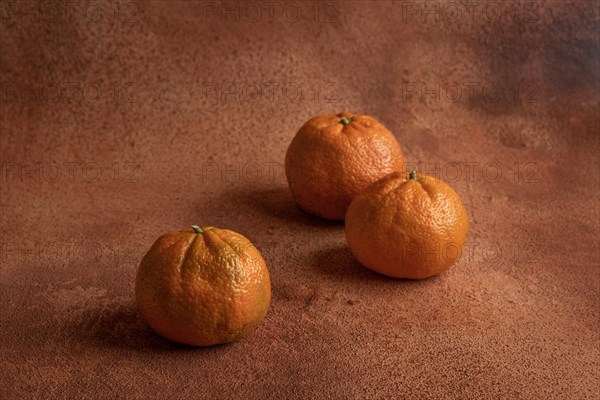 Tangerines on orange background