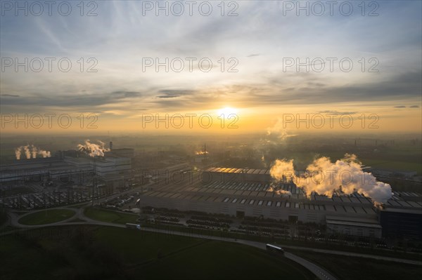 Drone aerial view of working steel plant at dawn