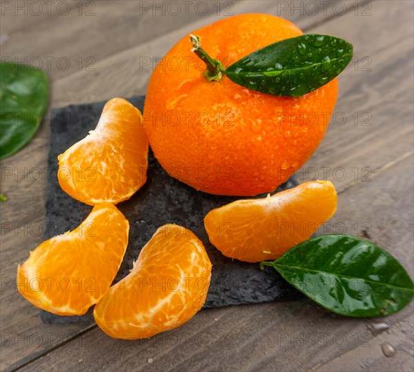 Fresh tangerines sweet clementines with drops of water