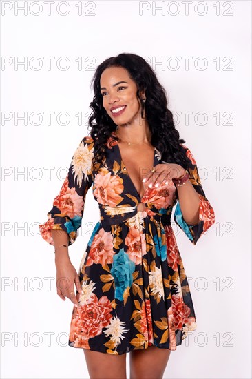 Mulatto woman dancing on a white background