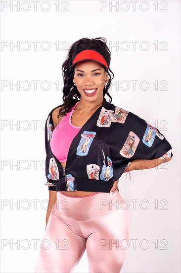 Portrait of black ethnic woman dancing on a white background