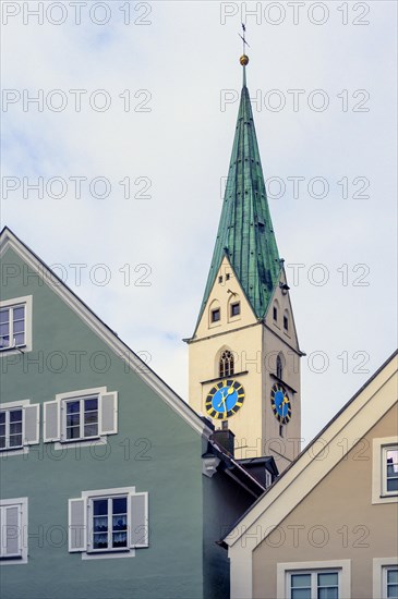 Pointed gable and steeple with clocks of the St. Mang Church