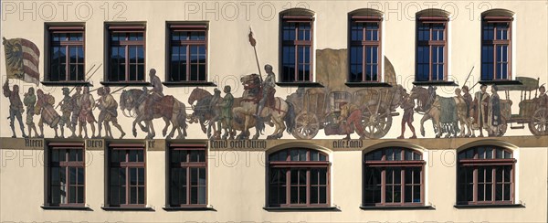 Historical mural of a medieval merchant procession