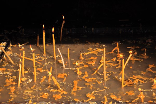 Sacrificial candles in monastery. The Voronet Monastery