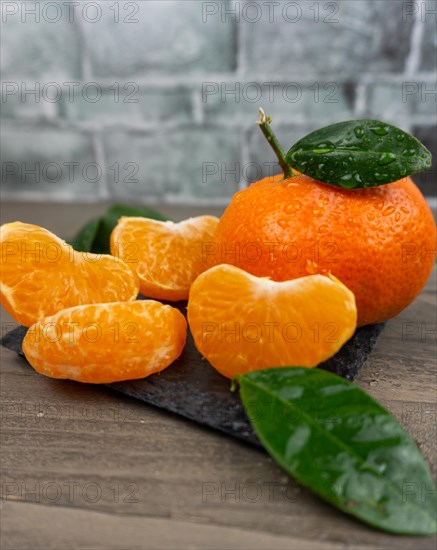 Fresh tangerines sweet clementines with drops of water