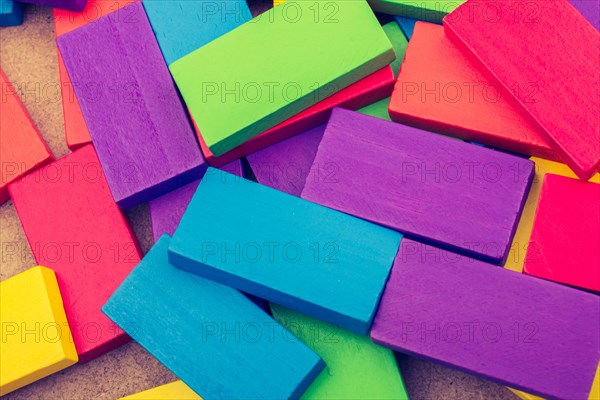 Wooden blocks of various color randomly scattered