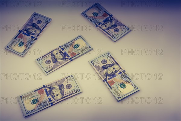 American 100 dollar banknote bundles placed on white background