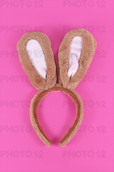 Cute costume easter bunny ears headband on pink background