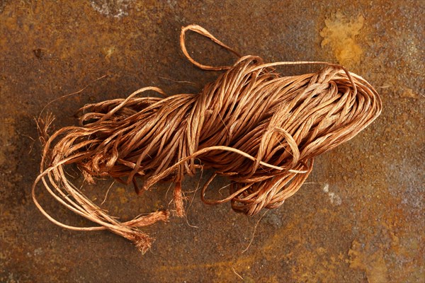 Red metal copper wire scrap materials recycling of waste from manual wire tearing. Closeup of copper waste in the form of copper wires