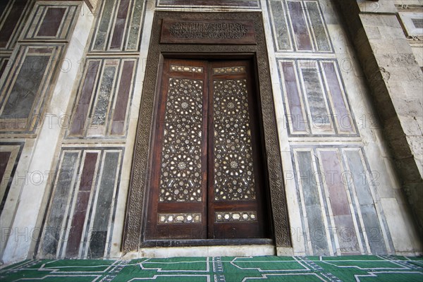 Wooden gate in the prayer room of the mosque