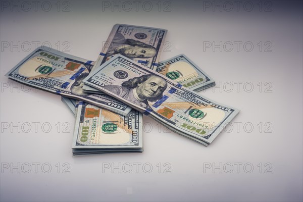 American 100 dollar banknote bundles placed on white background